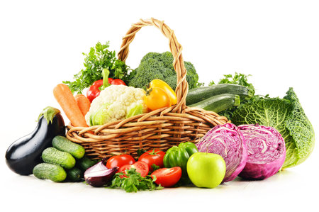 Composition with variety of fresh organic vegetables isolated on whiteの写真素材