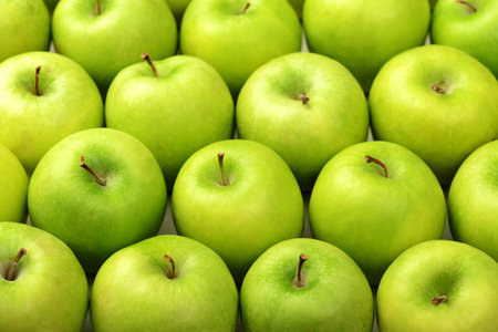 Green apples as background, closeup. Healthy dieting concept.の写真素材