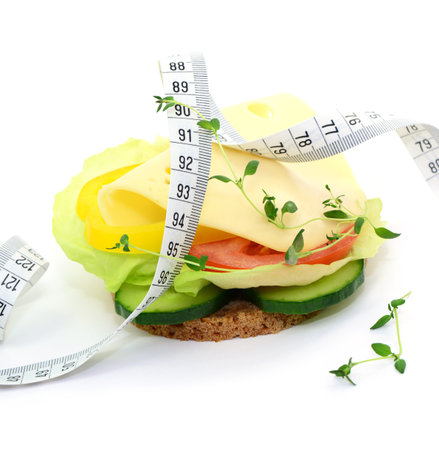 Healthy sandwich with cheese, tomato and cucumber isolated on white backgroundの写真素材