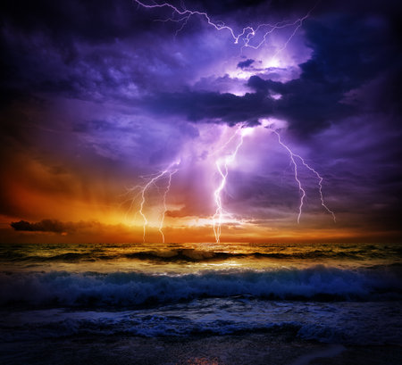 Stormy sky with lightning in the ocean. Collage. Nature.の写真素材