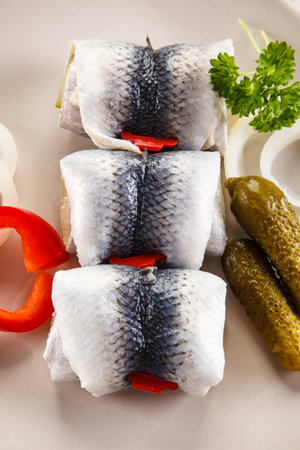 herring fillets with onion, pepper and pickled cucumbersの写真素材