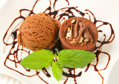 Mini chocolate cake and scoop of ice creamの写真素材