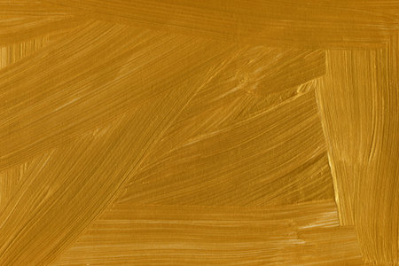 Gold paint brush stroke texture. Abstract background and texture for design.のeditorial素材