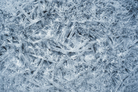 ice crystals on a frozen lake as a background, closeup of photoのeditorial素材