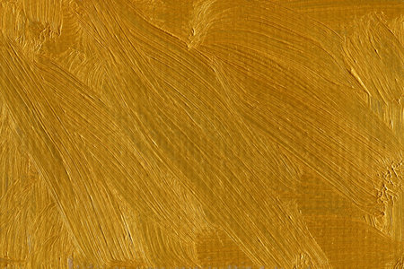 Gold paint brush strokes on canvas. Abstract background and texture for design.のeditorial素材