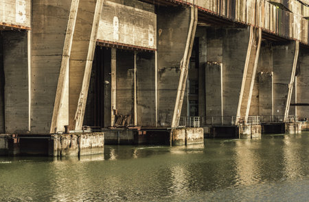 Abandoned dam on the river in the city. Toned.のeditorial素材