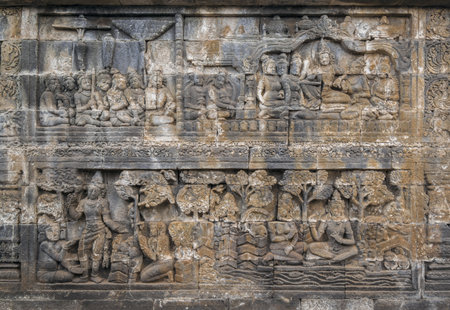 Bas-reliefs on the wall of the ancient temple in Yogyakarta, Java, Indonesiaのeditorial素材