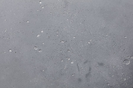 Water drops on grey background. Water drops on the ice surface.