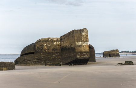 Bunker on the beach at low tide, Normandy, France.