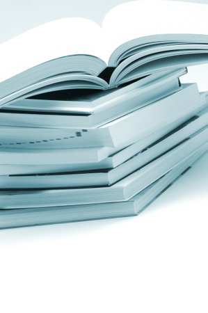 Pile of hardcover books on a white background. Toned.のeditorial素材