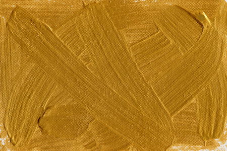 Gold paint on canvas. Abstract background. Gold paint on canvas.のeditorial素材