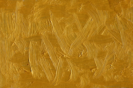 Gold paint on a wall as a background, closeup of photoのeditorial素材
