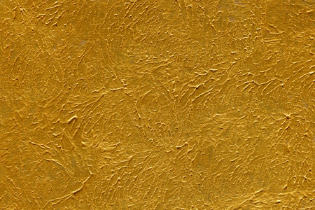 golden textured wall background. gold texture for design and decorationのeditorial素材