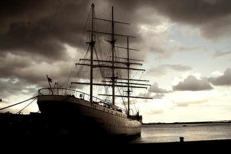 Old ship in the port of St. Petersburg at sunset, Russiaのeditorial素材