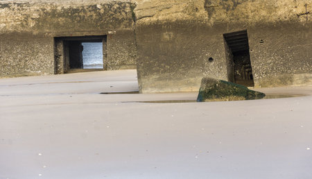 Abandoned bunker on the beach of the north sea in Normandy, Franceのeditorial素材