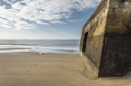 Concrete bunker on the beach at low tide, Normandy, Franceのeditorial素材