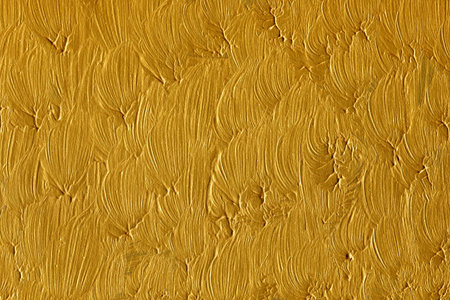 Gold paint on the wall as an abstract background. Texture, patternのeditorial素材
