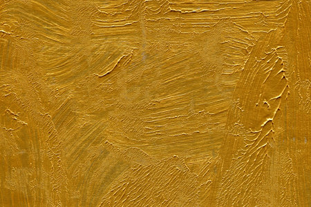 Gold paint textured wall. Abstract background and texture for design.のeditorial素材