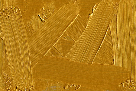 Gold paint on the wall as a background, closeup of photoのeditorial素材
