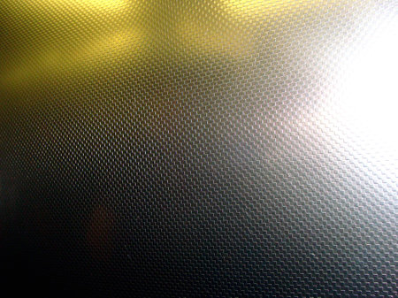 abstract background: black and yellow lights on a metal surface.のeditorial素材
