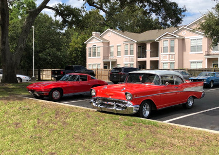Red and black old american cars in Brooklyn, New York.