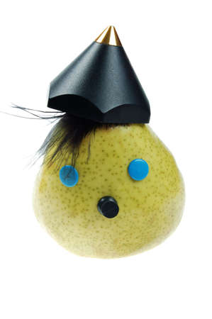 funny face with hat from green pear. isolated over white. see more funny faces from portfolioの写真素材