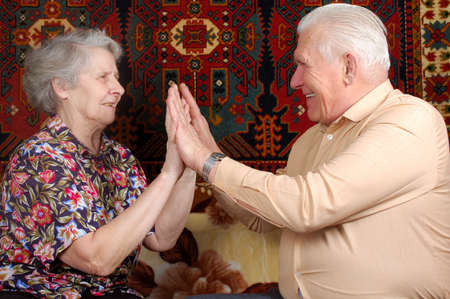 seventy year old couple clap one`s handsの写真素材