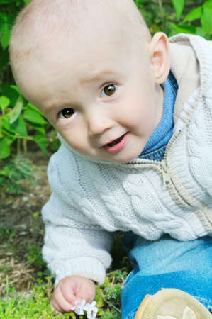 pretty baby sit on grass 