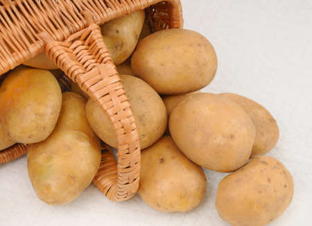 raw potatoes in basketの写真素材