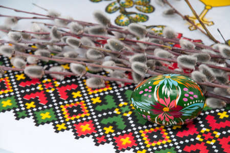 pussy-willow twigs with Easter eggs isolated on whiteの写真素材