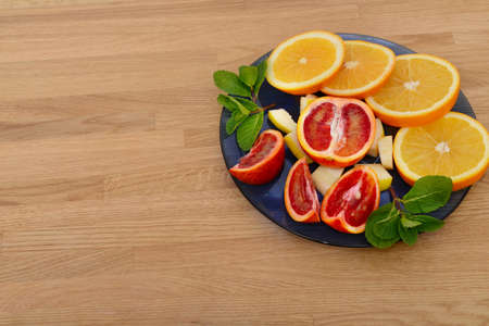 Mix citrus fresh fruit on the wooden table