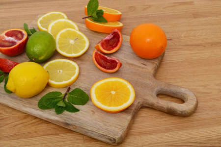 Mix citrus fresh fruit on the wooden tableの写真素材