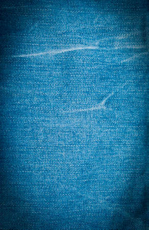 Blue denim background, detailed texture with vignetteの写真素材