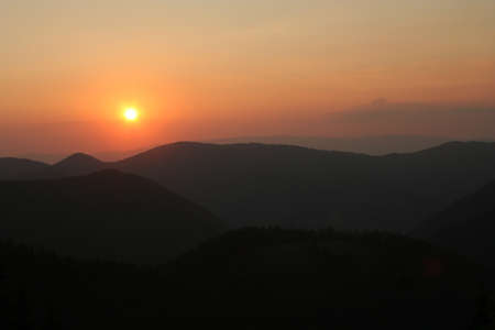 Sunset over the mountainsの写真素材