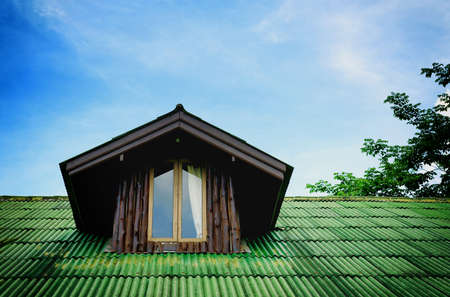 Room under the roof with dark woodenの写真素材