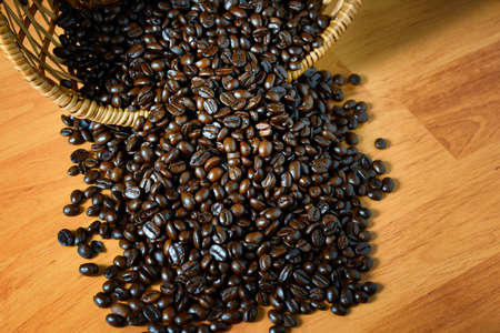 Coffee beans on wooden boardの写真素材