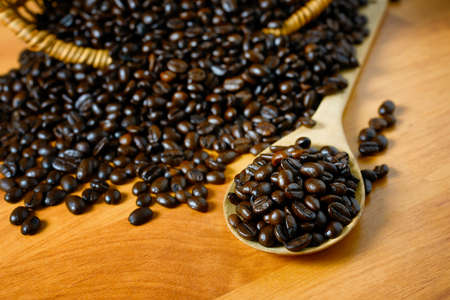 Coffee beans on wooden boardの写真素材