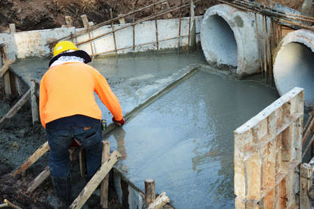 Man work on concrete sewer