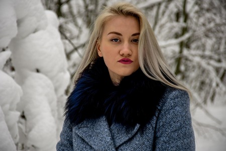 blonde in the winter forestの写真素材