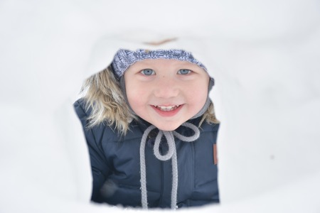 the child is playing in the snow