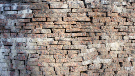 stone wall made of marble bricks. texture of walls of marble bricks. marble brick wall pattern. stone fenceの写真素材