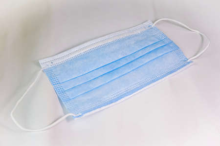 medical protective mask close up. means for protection of breath against respiratory infections. medical protection and hygieneの写真素材