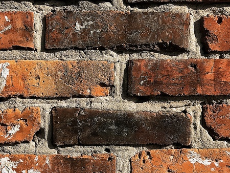 red brick wall texture grunge background with vignetted corners, may use to interior design