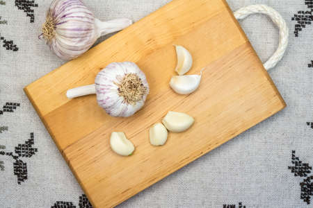Garlics on wooden tabuleteの写真素材