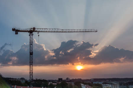 Construction crane during the sunsetの写真素材