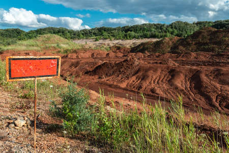 Old rusty information abandoned banner in countryside. Located near roadside.の写真素材