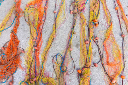 Fisherman nets texture background. Colorful fishing nets on pier. Drying fishing nets backdrop....