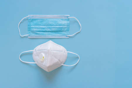 Disposable medical face mask and respirator with filter for choosing. Different protection - medical face mask and respirator. protection concept.の写真素材