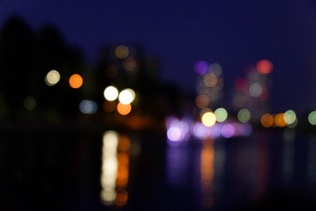 image of blurred bokeh background with warm colorful lights. (vintage tone).の写真素材