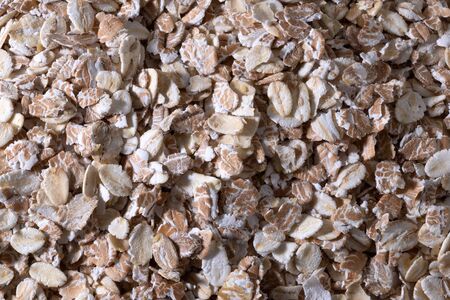 rolled oat. oat flakes photo. oat background. Top view closeupの写真素材